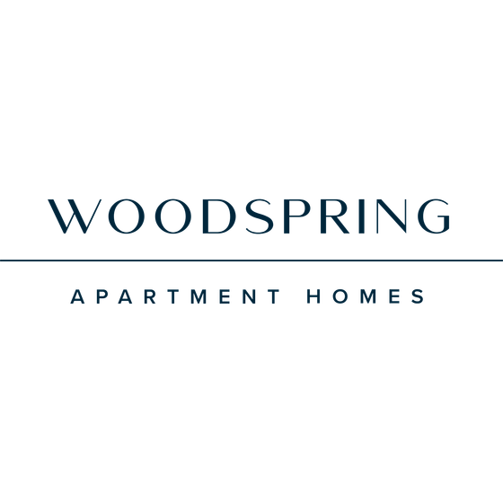 Elegant logo of Woodspring Apartment Homes, showcasing modern typography with a sleek, professional design.