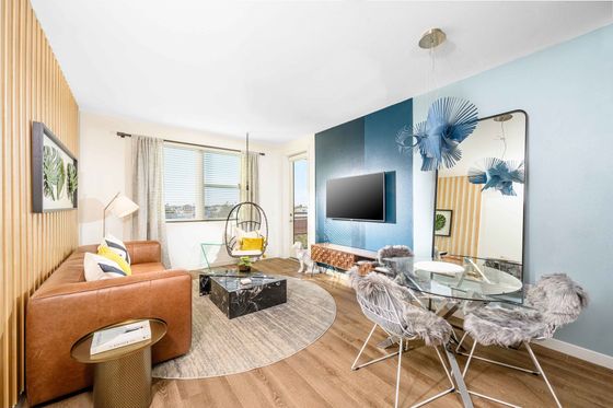 livingroom with leather sofa, wood like vinyl flooring at arte west apartments