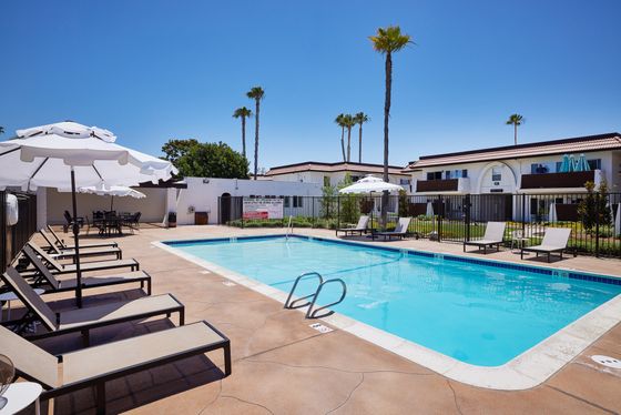 Villa Del Mar Pool and Lounge area with umbrellas
