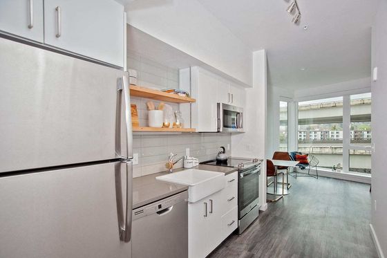 kitchen with stainless steel appliances at oro apartments