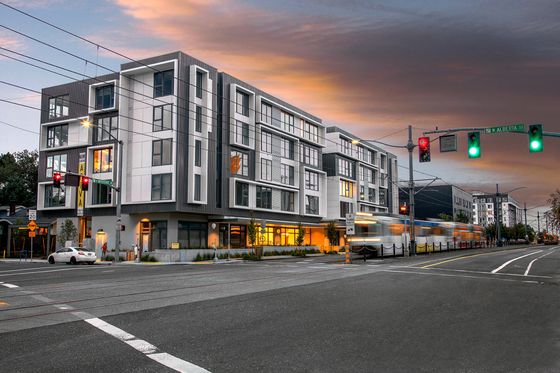 kitty-corner view of the 4 story Aniva Apartments building