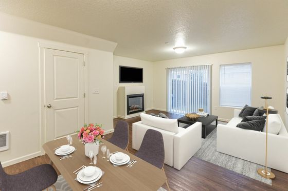 living room with white couches and black coffee table and faux wood like flooring at fairview court