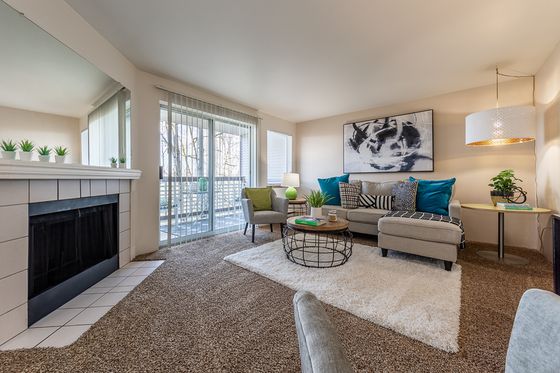 livingroom with fireplace and carpet at berkeley heights apartments