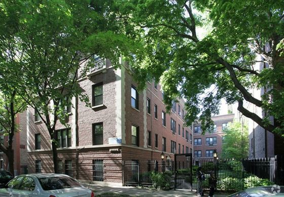 1360-64 East 52nd Street a handsome twenty two unit 3.5 story red brick courtyard building on a tree lined street in Hyde Park.