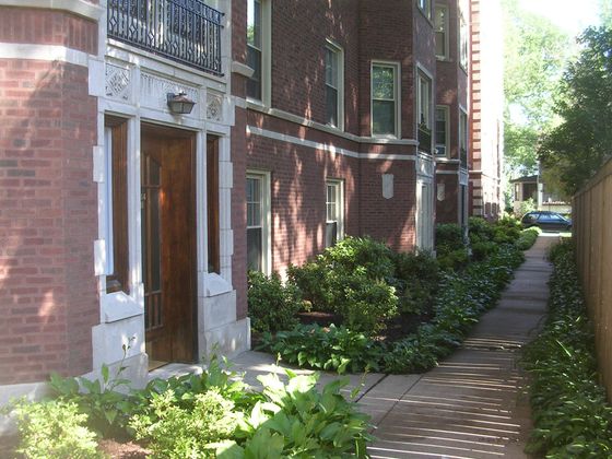 914 Crain a handsome fifteen unit 3.5 story vintage red brick and limestone building with landscaped grounds in Evanston.