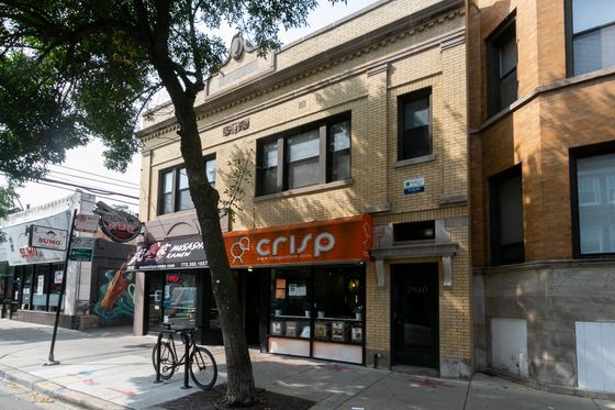 2940 North Broadway a handsome vintage five unit two story yellow brick building with two storefronts on the first floor in Lakeview.