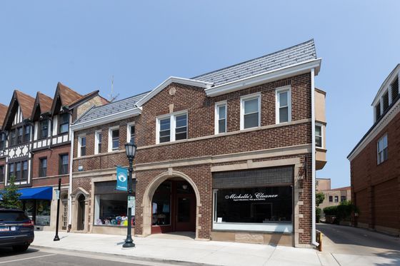 805-09 West Elm a four unit two story vintage red brick property with two storefronts in Winnetka.