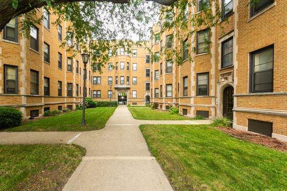 Lakeside Manor a handsome one hundred and three unit 3.5 story yellow brick courtyard building with a private beach in South Shore.