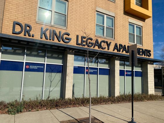 Doctor King Legacy Apartments a forty six unit income restricted yellow brick building with glass storefronts on the first floor in Lawndale.