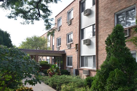 Lotus Garden Apartments a one hundred and twenty unit three story mid century brick property with nicely landscaped grounds in Skokie.