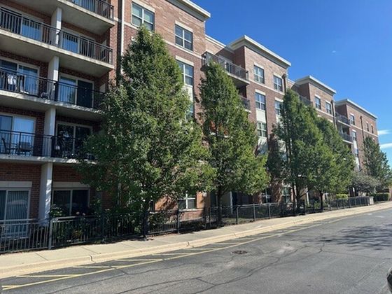 Victory Senior Center a one hundred and eleven unit 3.5 story red brick senior property with mature trees in Vernon Hills Illinois.