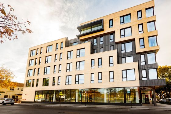 Modern deign apartment building with yellow and dark gray exterior