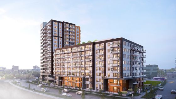 Modern urban apartment complex with sleek architecture and spacious balconies, offering vibrant city living with scenic views.