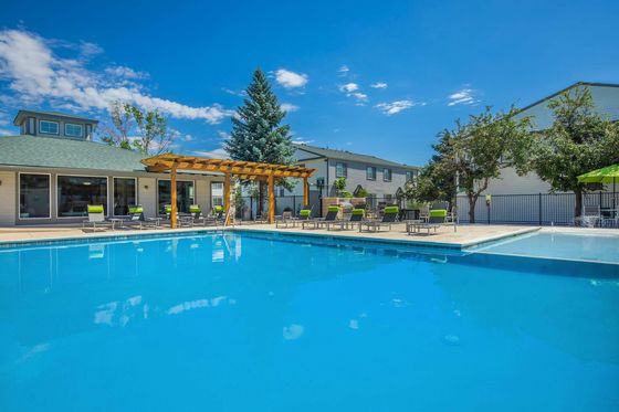 Briar Grove Townhomes Swimming Pool with Lounge Chairs and Covered Trellis