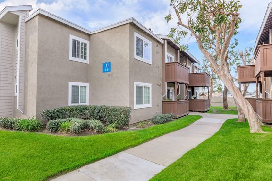 Copper Wood Apartment Homes Building Exterior with Balconies and Walkway