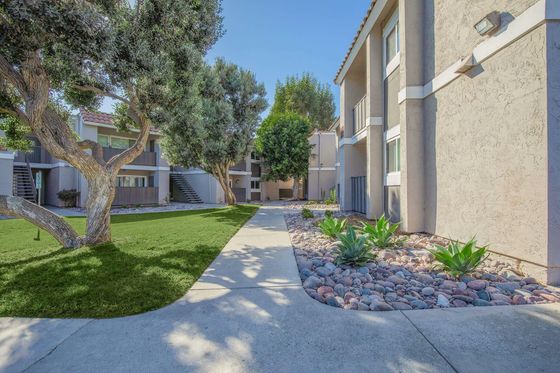 Ocean Vista Apartment Homes Walkway to Exterior Entrances, Apartments with balconies and patios and lush landscaping
