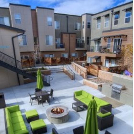 Courtyard common space with lounge seating and a fire pit