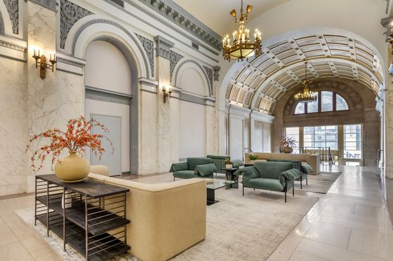 Sophisticated lobby with vaulted ceiling, chandeliers, and plush seating.