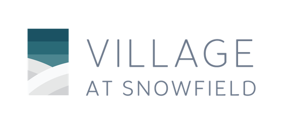 Elegant logo of Village at Snowfield featuring modern design in shades of blue and gray.
