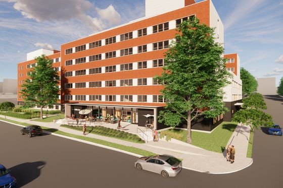 Vibrant cityscape featuring a modern brick apartment building with lush greenery and street views, perfect for urban living.