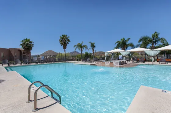 campus crossings at star pass tucson arizona poll area with cabanas and chairs.