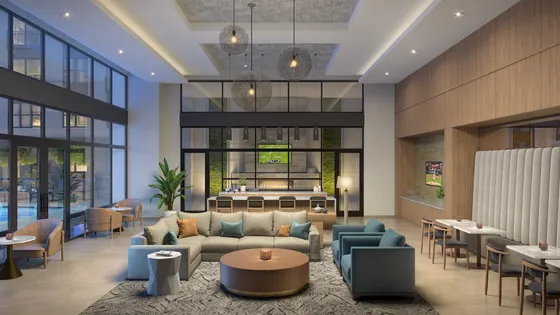 Stunning lounge area with contemporary furniture, elegant lighting, and a spacious bar area.