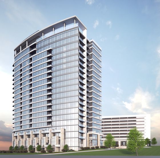 Modern high-rise apartment building with sleek glass facade and balconies, set against a clear blue sky.