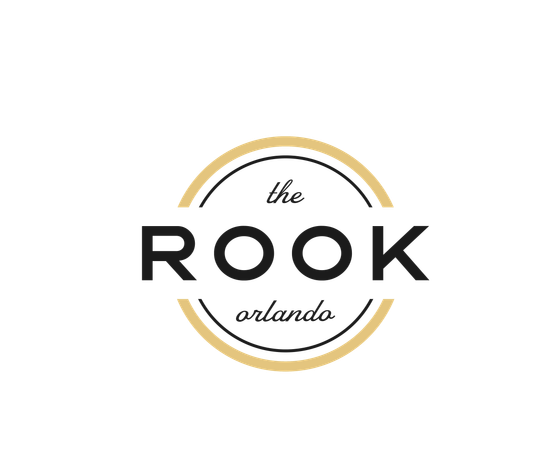 Sleek and modern logo for The Rook Orlando with a stylish black and gold design.