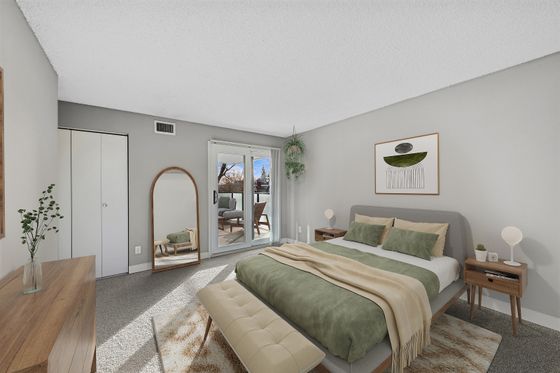 Elegant bedroom interior with modern decor, featuring a plush bed, minimalist furniture, and a serene balcony view.