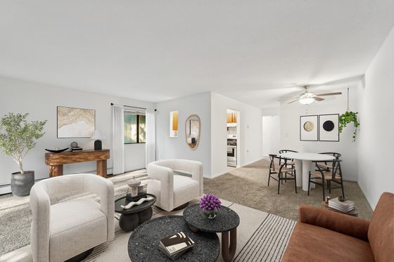 Spacious and bright living and dining area with modern decor, featuring cozy seating, stylish dining set, and abundant natural light.