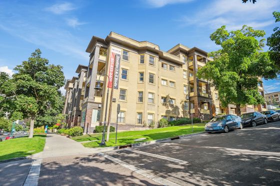 Charming apartment building with lush landscaping and convenient street parking, offering studio to 2-bedroom units in a vibrant community.