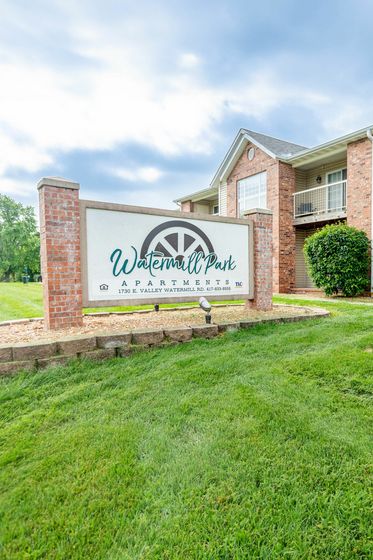 Watermill Park Apartments sign and apartment building
