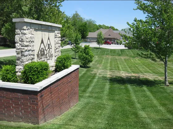 Beautiful entrance sign with landscaped lawn at Martindale Estates Homes.