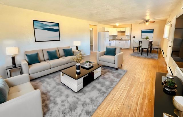 Spacious open-concept living and dining area with modern decor and natural light.