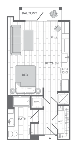 Modern studio floor plan featuring an open kitchen, cozy bed area, spacious bathroom, walk-in closet, washer/dryer, and a balcony with stylish living space.
