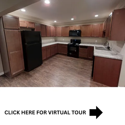 Inviting and spacious kitchen with rich wood cabinetry, modern appliances, and elegant countertops, perfect for culinary creativity.