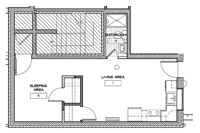 Modern floor plan showcasing a spacious living area, sleeping area, and a well-designed bathroom.