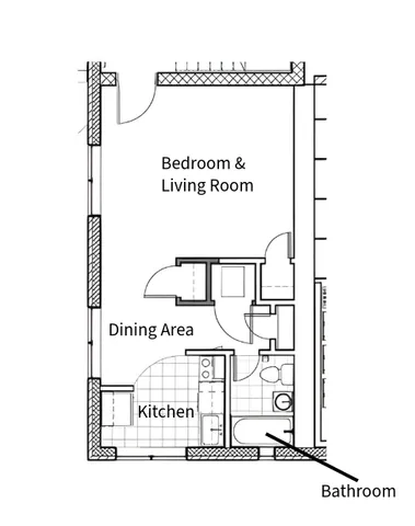 Cozy floor plan with integrated bedroom and living room, a dining area, efficient kitchen, and a compact bathroom.