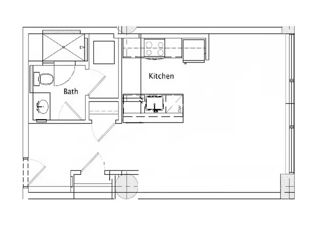 Modern floor plan featuring a spacious kitchen and an adjacent bathroom, ideal for compact living.