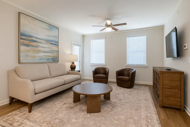 A spacious and well-lit living room designed for comfort and relaxation.