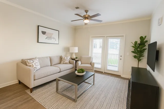 A spacious and well-lit living room designed for comfort and relaxation.