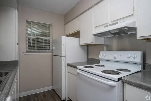 Kitchen with electric range in 1 bedroom floor plan at Meadow Creek Apartments in Jackson, MS