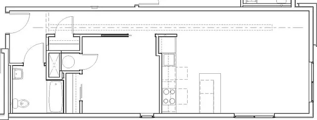 Modern floor plan displaying an open-concept kitchen and expansive living area, complemented by a luxurious bathroom and convenient storage space.