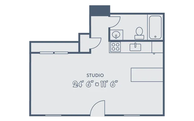 Modern studio apartment floor plan featuring an efficient layout with kitchen and bathroom, 24\'6&rdquo; by 11\'6&rdquo; dimensions.