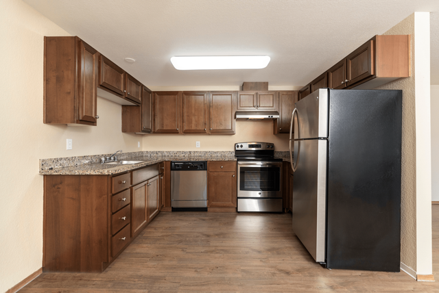 Beautiful upgraded kitchen with stainless steel appliances and wood flooring.