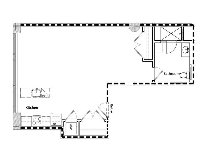 Modern studio floor plan featuring an open-concept kitchen, a spacious bathroom, and convenient entry.