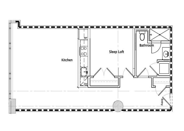 Modern studio floor plan featuring a kitchen, sleep loft, and bathroom with strategic entry layout.