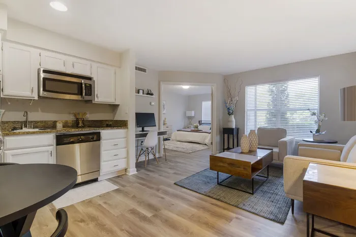 furnished living, dining and kitchen area in apartment home