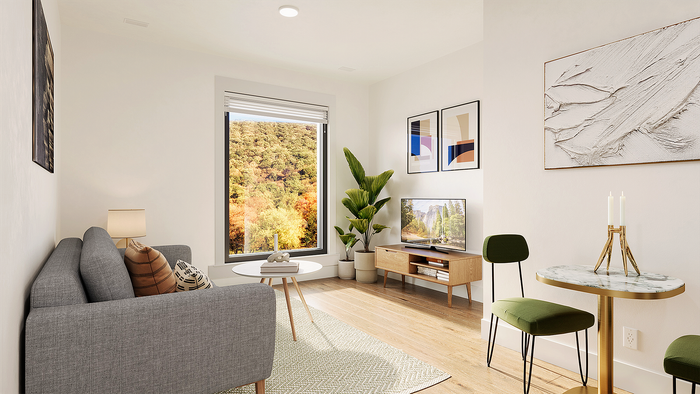 Bright and welcoming living room with stylish decor, large window showcasing serene natural views, and elegant furniture for a cozy atmosphere.
