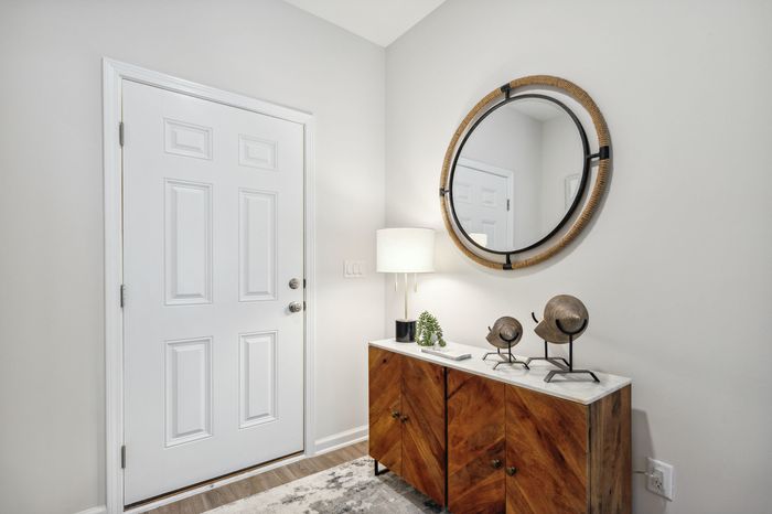 Furnished Entry Way with table and mirror